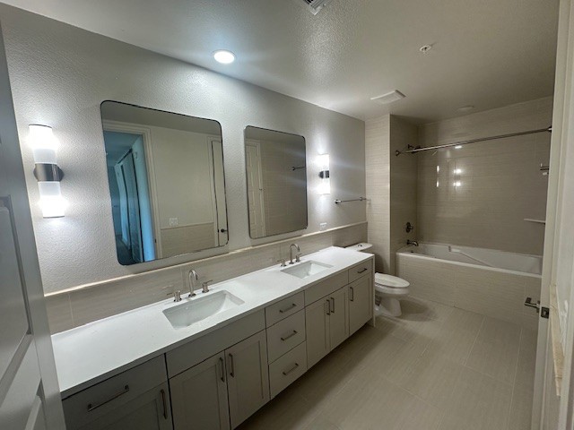 214 Barton Springs Road, Unit 922 Austin, TX 78704 - Photo 9 of 20 a bathroom with a double vanity sink mirror double and bathtub