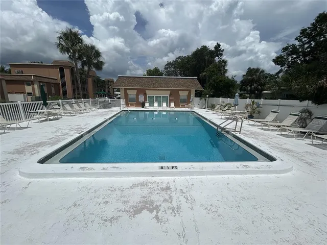 a view of swimming pool with a yard