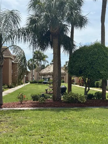 a front view of a house with a yard table and chairs