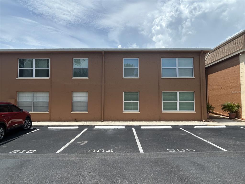 12760 Indian Rocks Road, Unit 904 Largo, FL 33774 - Photo 3 of 40 a black car parked in front of a building