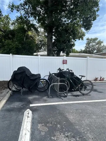 a kitchen with a table chairs and refrigerator