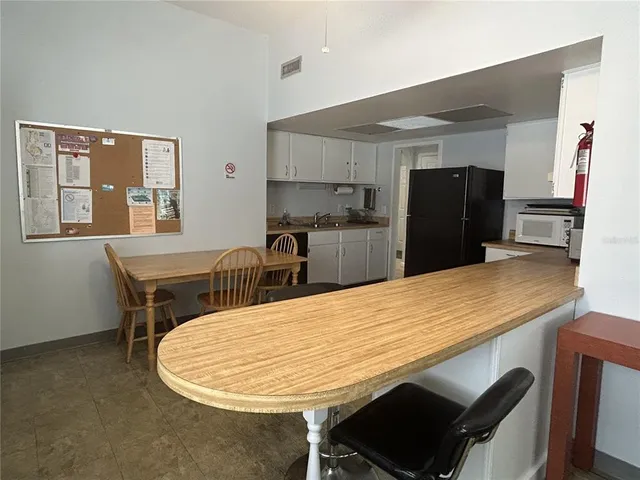 a front view of multiple houses with yard