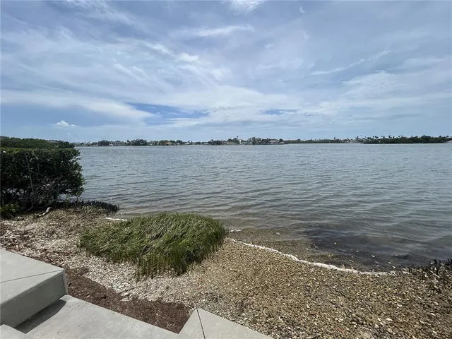a view of a lake from a yard