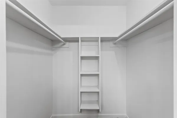 a view of an empty walk in closet