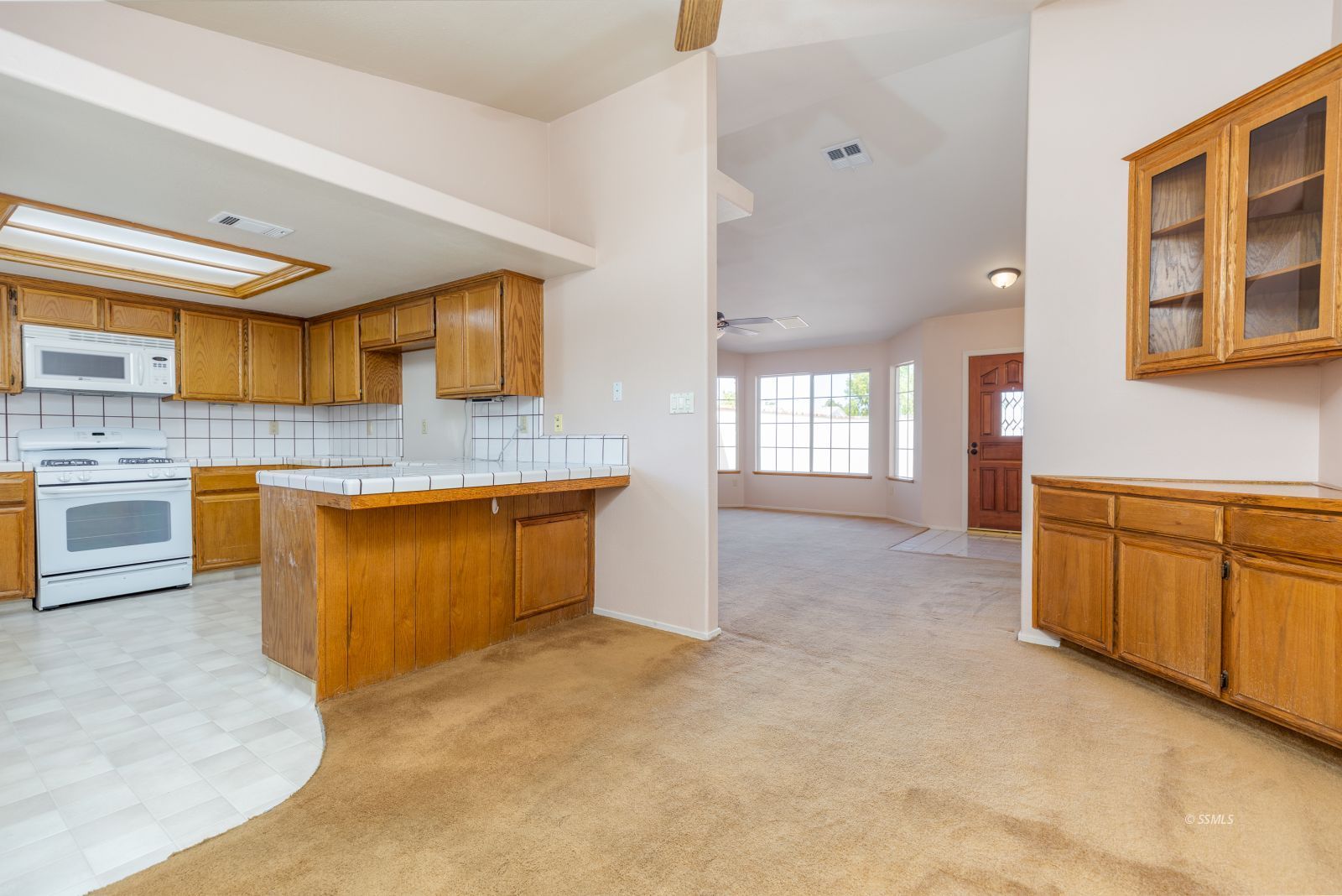 413 Petris Avenue Ridgecrest, CA 93555 - Photo 11 of 30 a kitchen with stainless steel appliances granite countertop a stove sink and cabinets