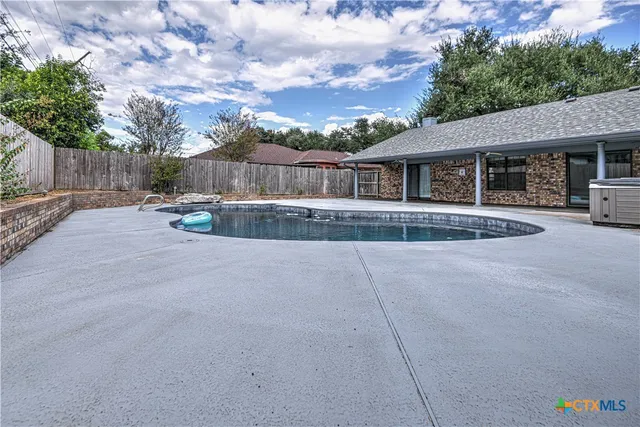 a view of outdoor space swimming pool and furniture
