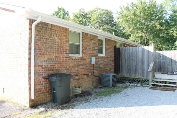 a backyard of a house with a sink