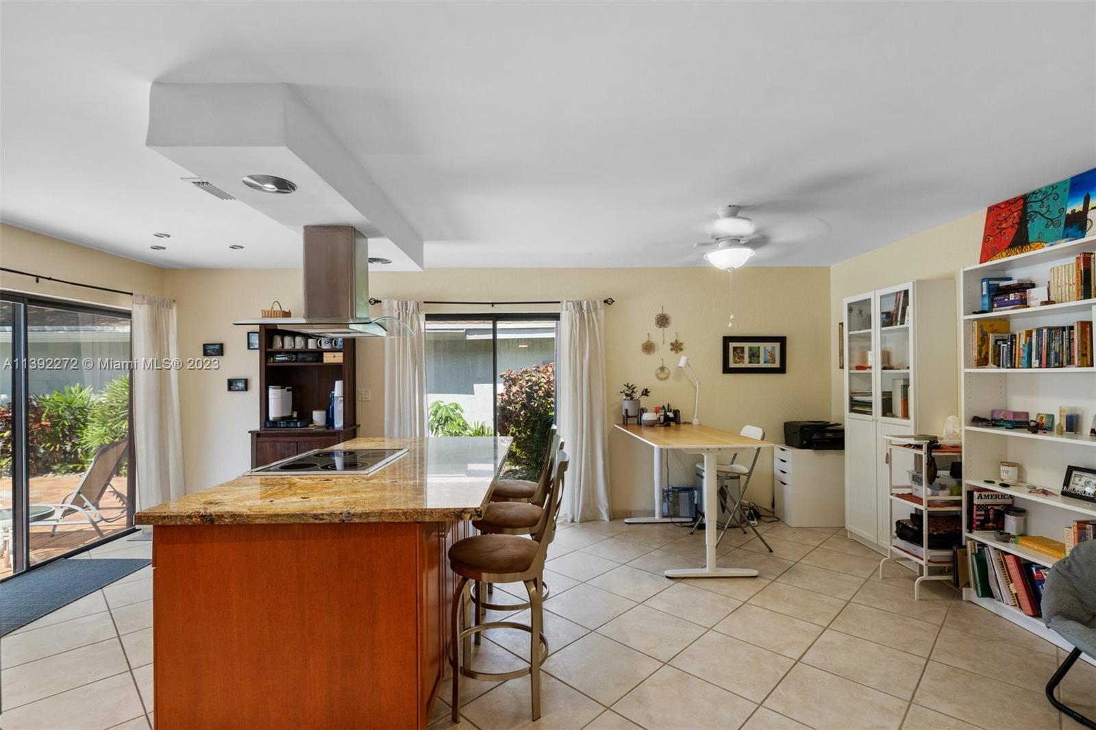 28 Cedar Road Hollywood, FL 33021 - Photo 12 of 43 a living room with furniture and a flat screen tv