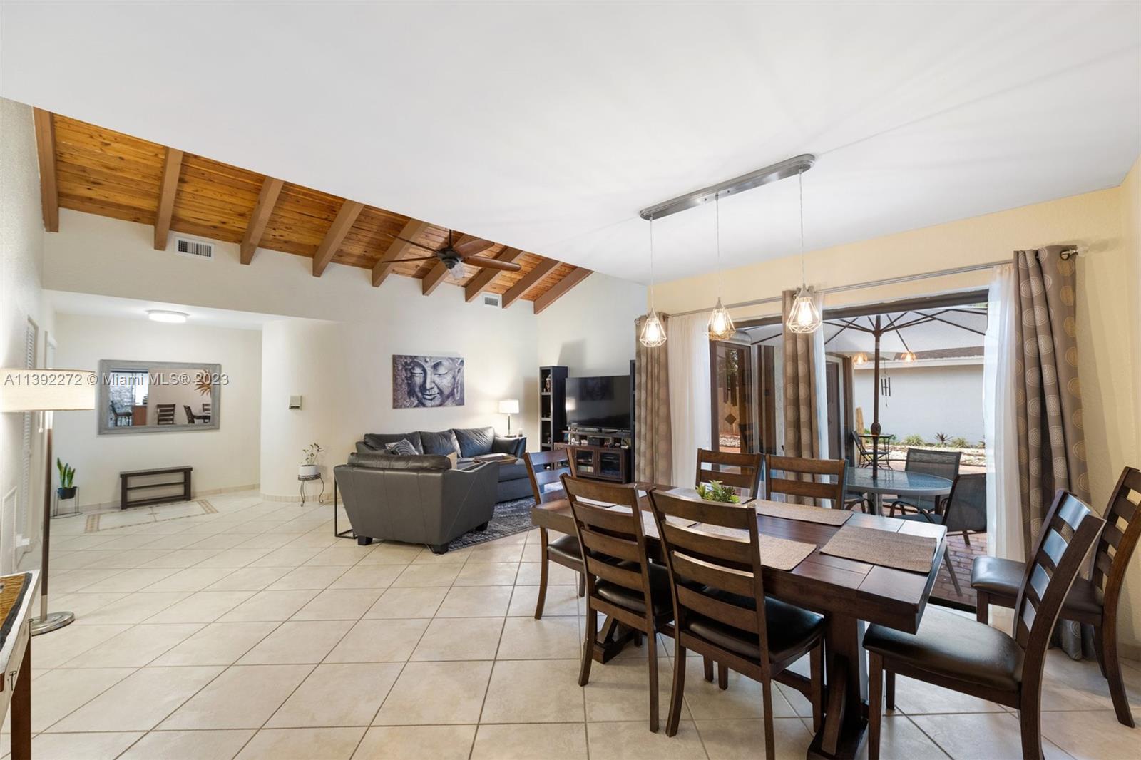 28 Cedar Road Hollywood, FL 33021 - Photo 15 of 43 a living room with furniture and a flat screen tv