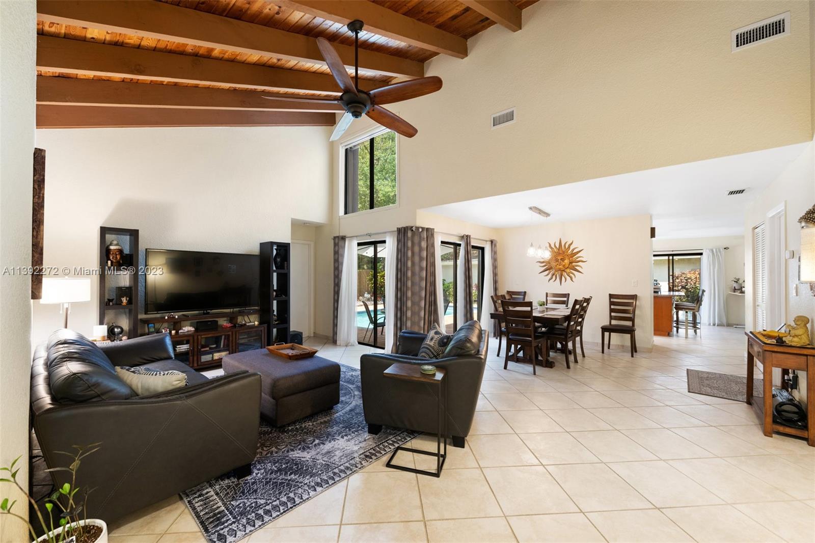 28 Cedar Road Hollywood, FL 33021 - Photo 16 of 43 a living room with furniture and a flat screen tv