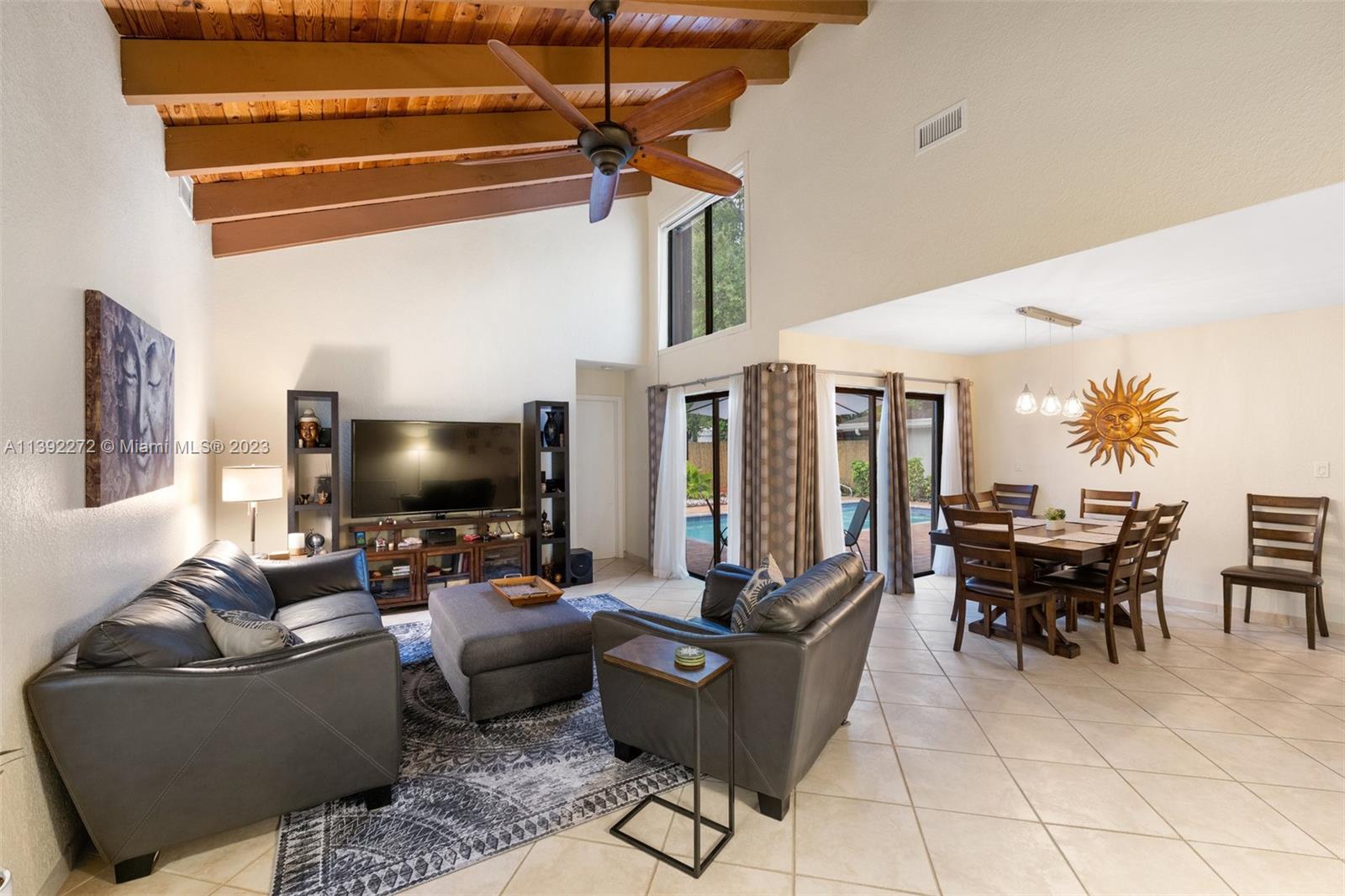 28 Cedar Road Hollywood, FL 33021 - Photo 17 of 43 a living room with furniture and a flat screen tv