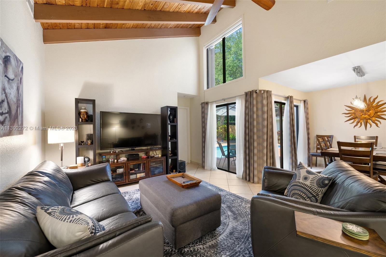 28 Cedar Road Hollywood, FL 33021 - Photo 18 of 43 a living room with furniture and a flat screen tv