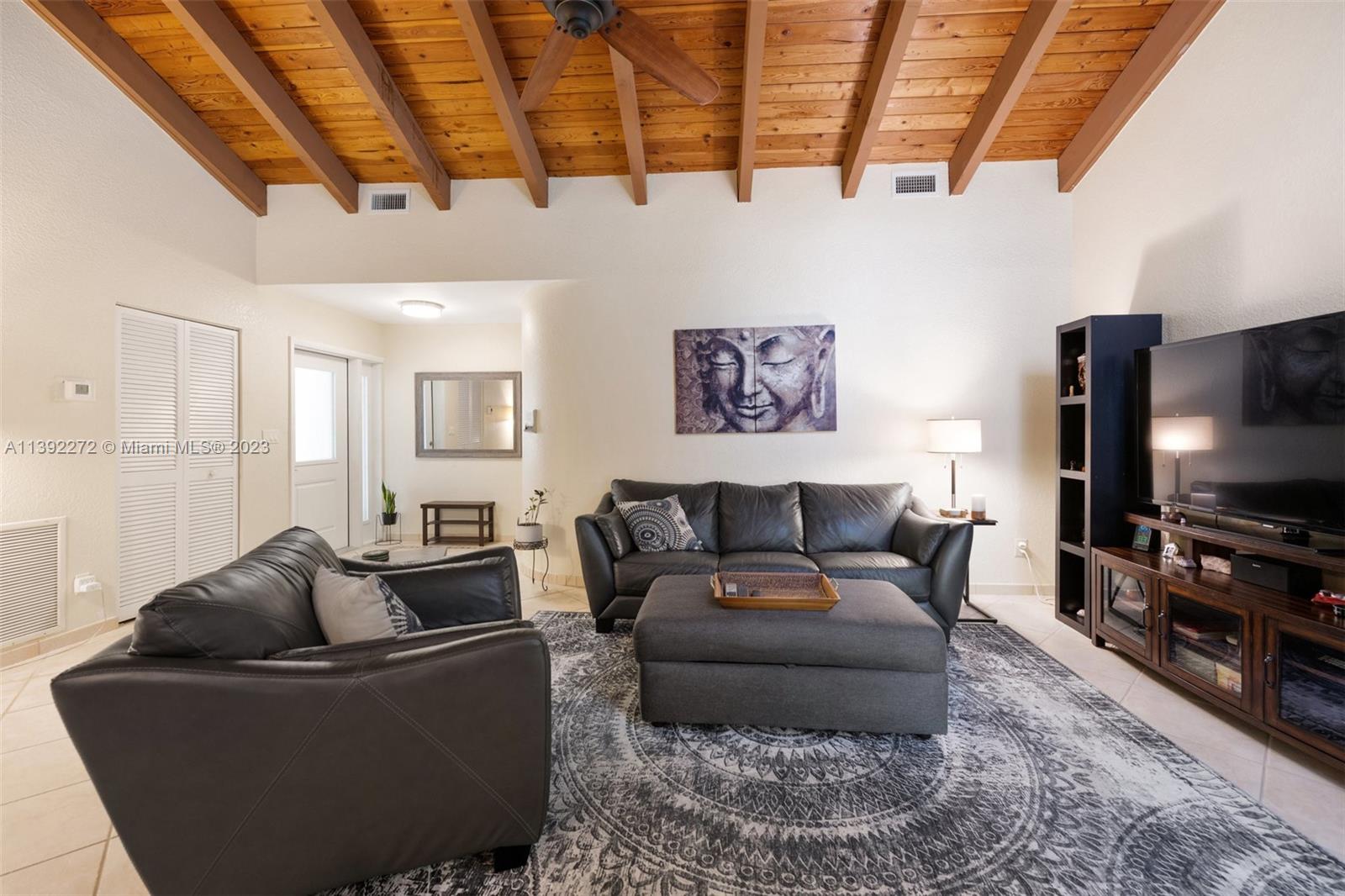 28 Cedar Road Hollywood, FL 33021 - Photo 19 of 43 a living room with furniture and a flat screen tv