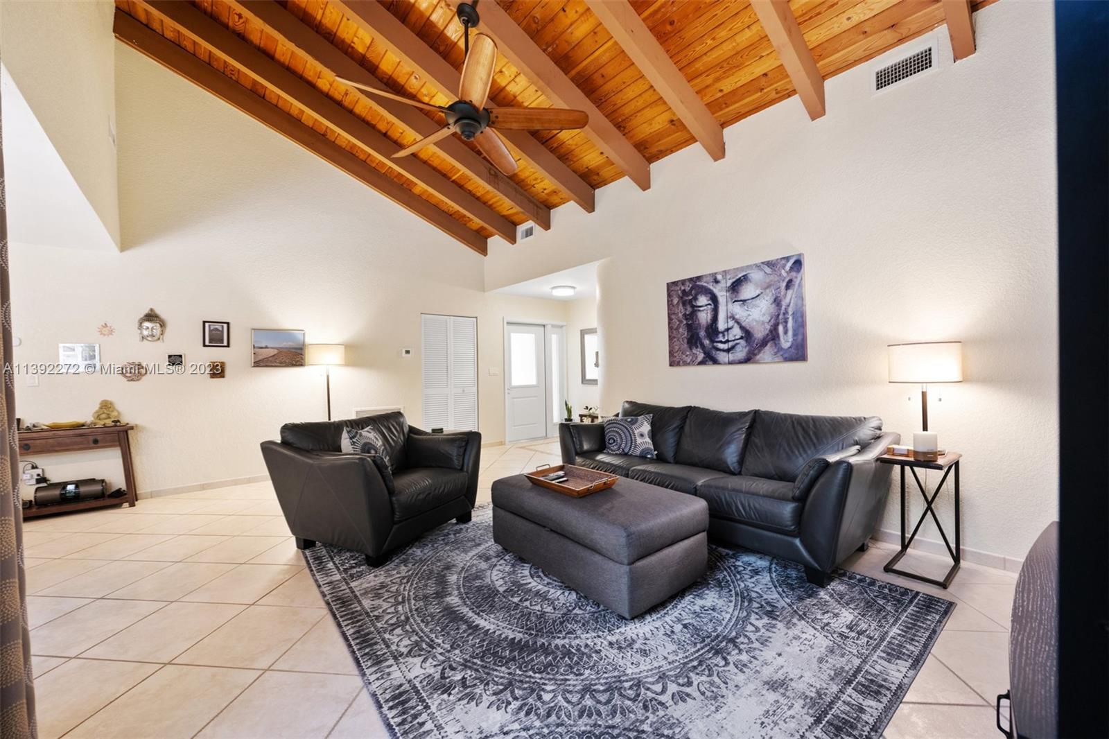 28 Cedar Road Hollywood, FL 33021 - Photo 22 of 43 a living room with furniture and a painting on the wall