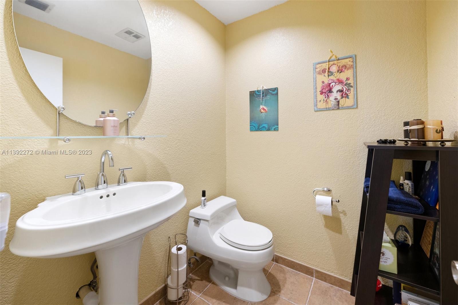 28 Cedar Road Hollywood, FL 33021 - Photo 23 of 43 a bathroom with a sink and a mirror