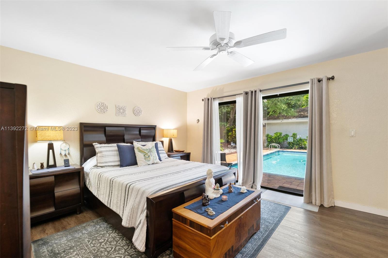 28 Cedar Road Hollywood, FL 33021 - Photo 24 of 43 a bedroom with a bed a mirror and a window