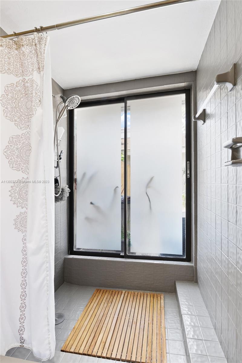 28 Cedar Road Hollywood, FL 33021 - Photo 28 of 43 a view of a bathroom with a shower