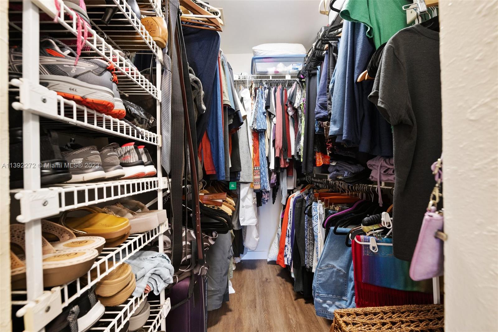 28 Cedar Road Hollywood, FL 33021 - Photo 29 of 43 a view of walk in closet with clothes