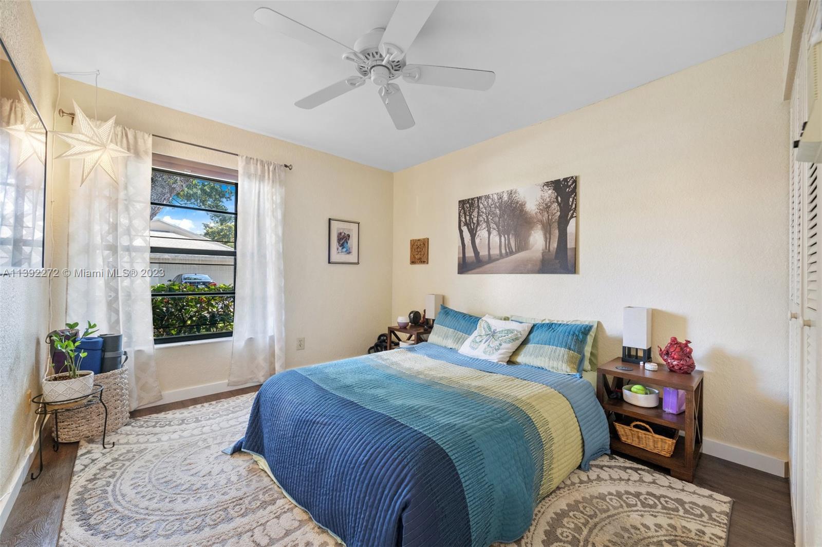 28 Cedar Road Hollywood, FL 33021 - Photo 30 of 43 a bedroom with a bed a dresser and a window