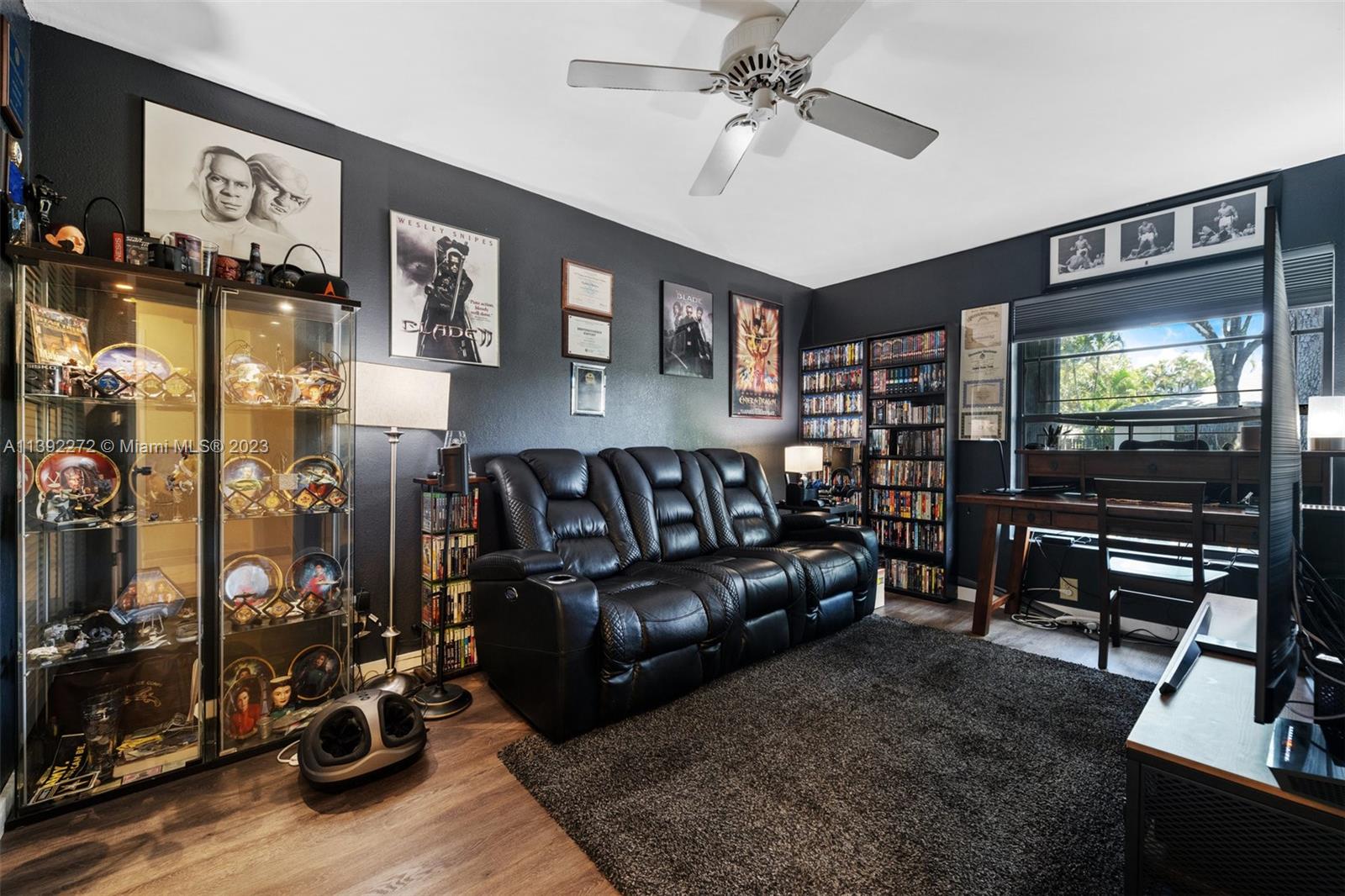 28 Cedar Road Hollywood, FL 33021 - Photo 31 of 43 a living room with furniture and a flat screen tv