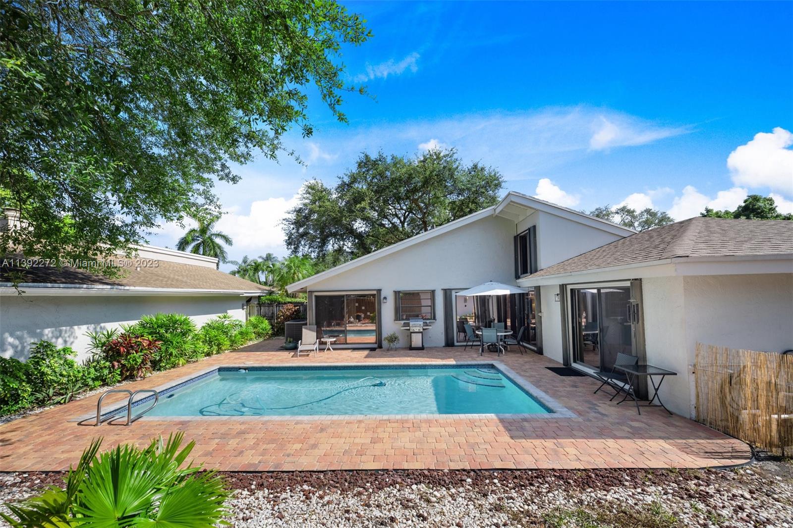 28 Cedar Road Hollywood, FL 33021 - Photo 36 of 43 a view of house with swimming pool outdoor seating