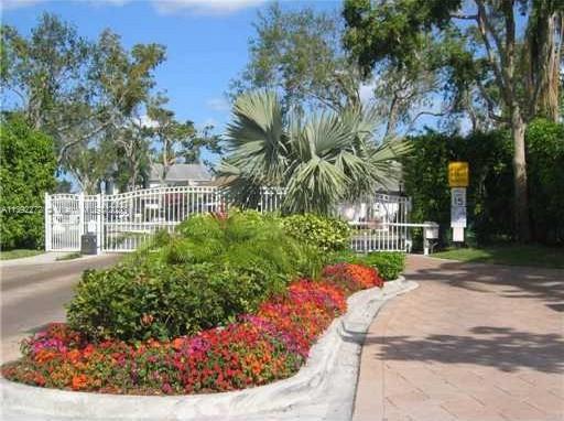 28 Cedar Road Hollywood, FL 33021 - Photo 43 of 43 a view of a garden with flowers and trees