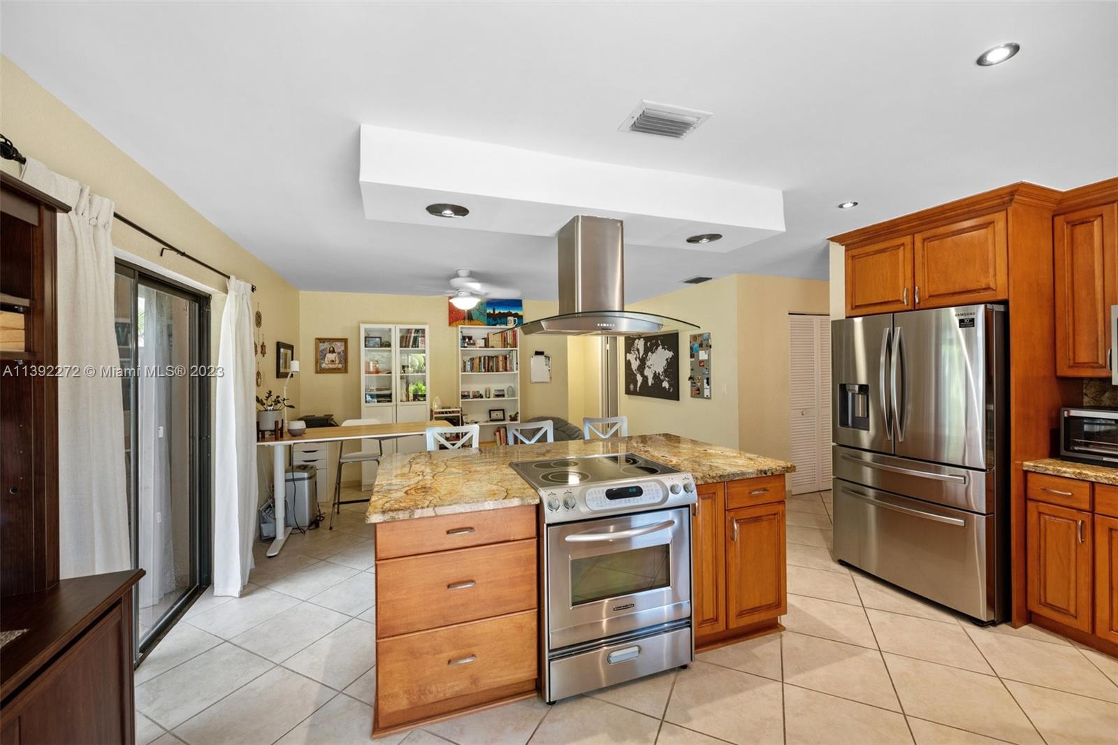 28 Cedar Road Hollywood, FL 33021 - Photo 9 of 43 a kitchen with stainless steel appliances granite countertop a refrigerator stove and sink