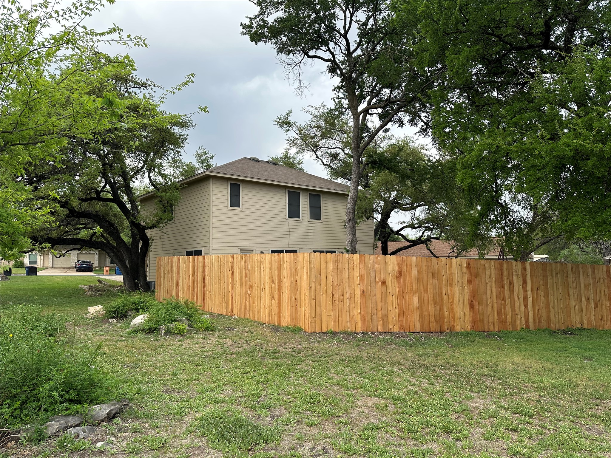 12307 Abney Drive Austin, TX 78729 - Photo 16 of 18 a house with a tree in front of it