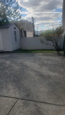 a view of a brick house with a yard