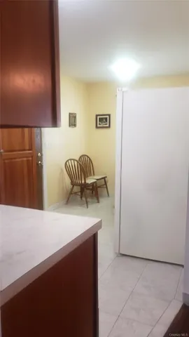 a kitchen with a refrigerator and a sink