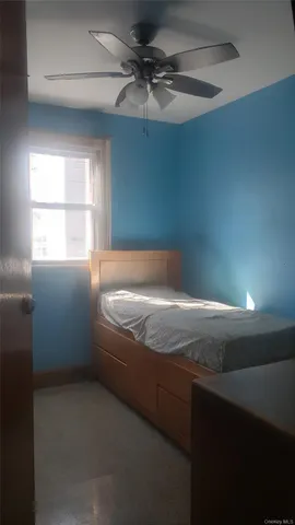 a bath tub sitting in a bathroom next to a window