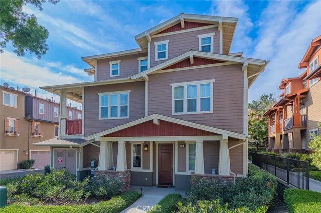 a front view of a building with a yard