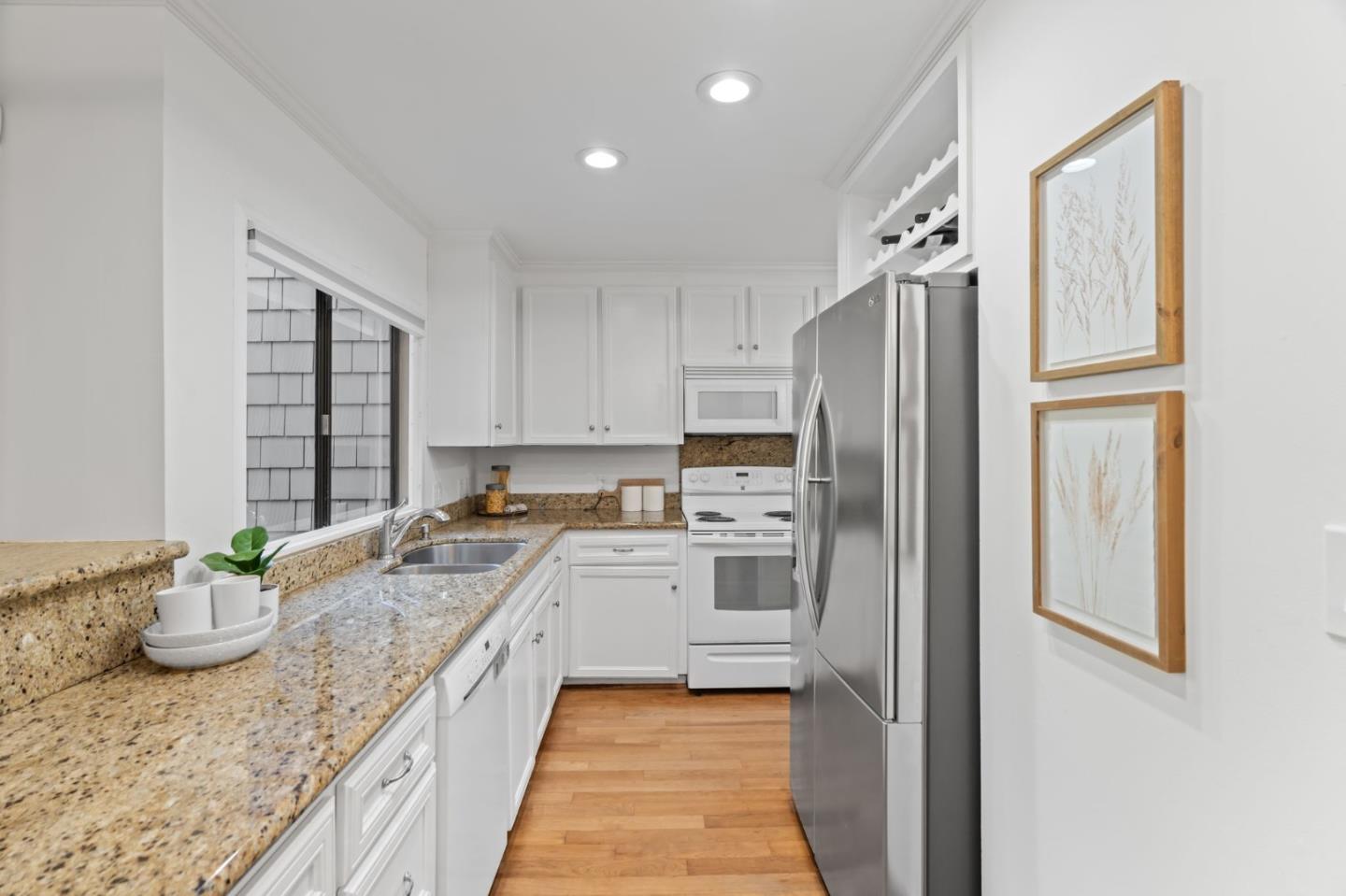 2146 Sand Hill Road Menlo Park, CA 94025 - Photo 11 of 40 a kitchen with a refrigerator sink and stove