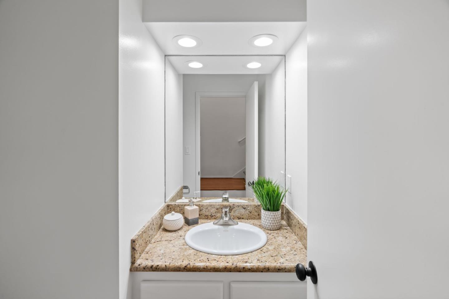 2146 Sand Hill Road Menlo Park, CA 94025 - Photo 18 of 40 a bathroom with a granite countertop sink and a mirror