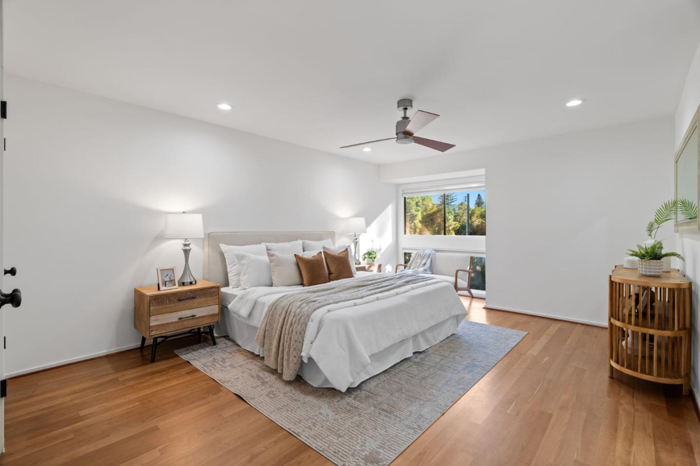 2146 Sand Hill Road Menlo Park, CA 94025 - Photo 19 of 40 a bedroom with a bed and wooden floor