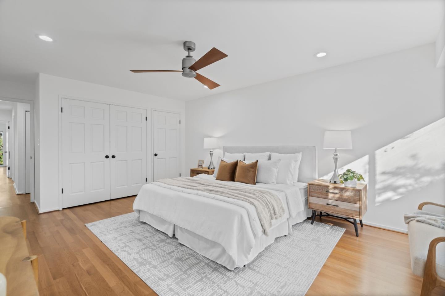2146 Sand Hill Road Menlo Park, CA 94025 - Photo 20 of 40 a bedroom with a large bed and wooden floor