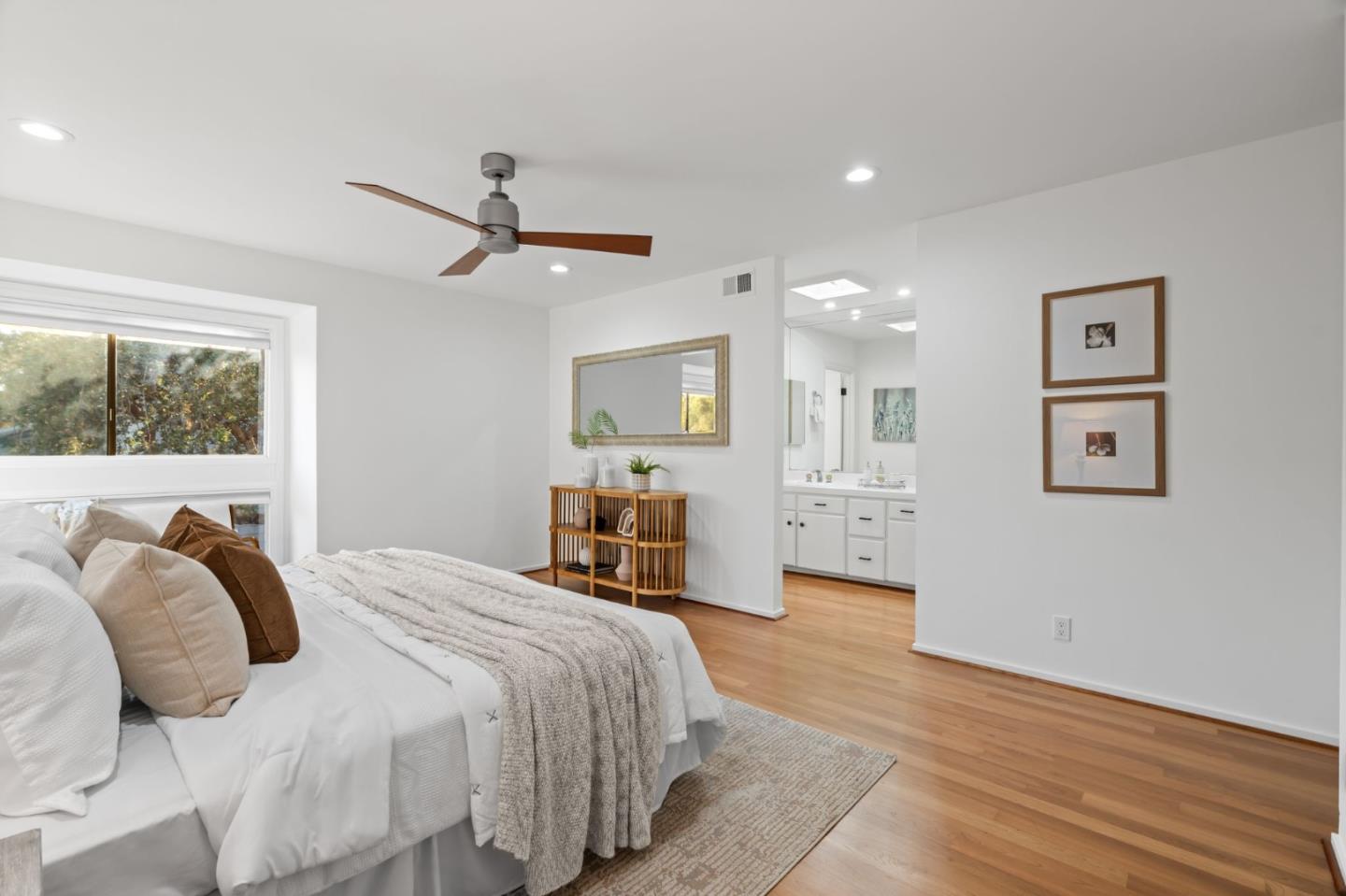 2146 Sand Hill Road Menlo Park, CA 94025 - Photo 21 of 40 a spacious bedroom with a bed and ceiling fan