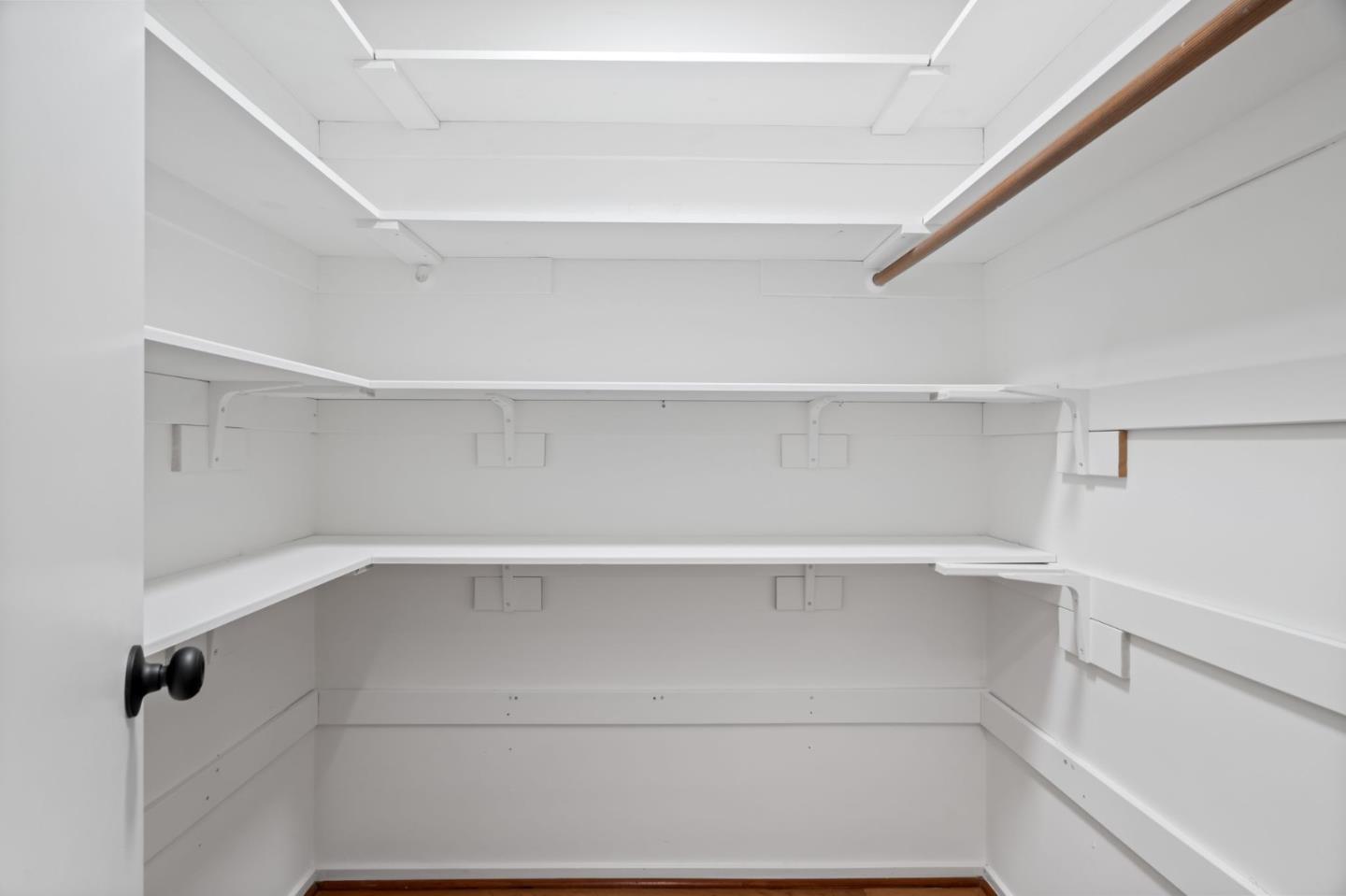 2146 Sand Hill Road Menlo Park, CA 94025 - Photo 25 of 40 a view of walk in closet with empty racks