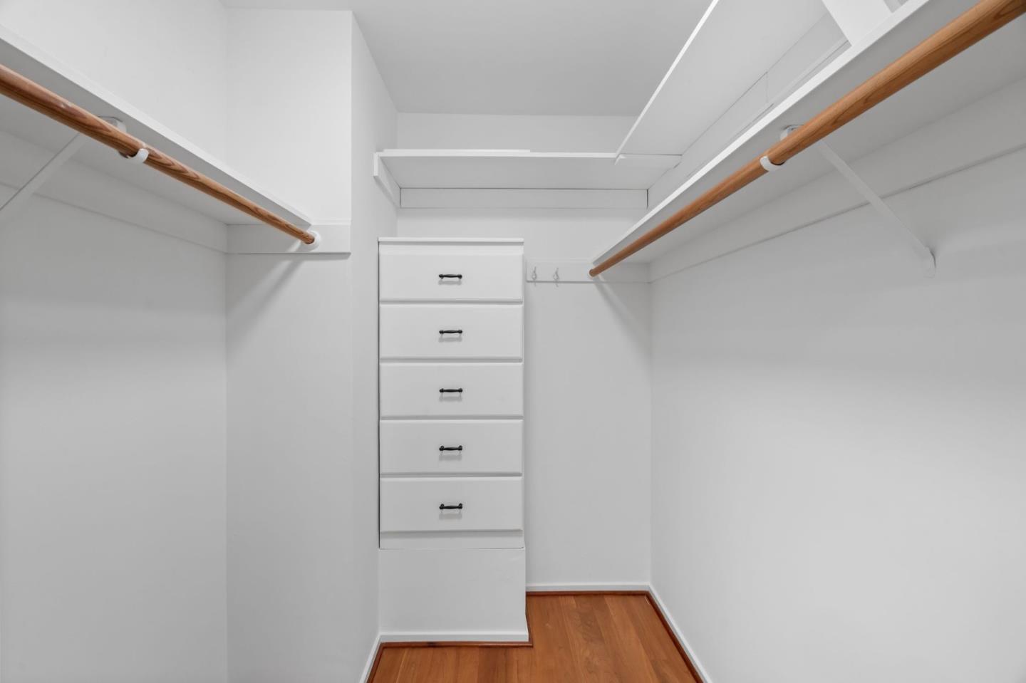 2146 Sand Hill Road Menlo Park, CA 94025 - Photo 26 of 40 a view of walk in closet with empty racks