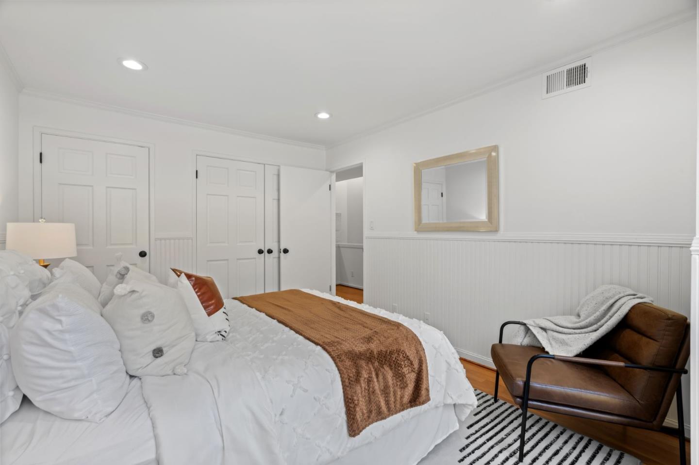 2146 Sand Hill Road Menlo Park, CA 94025 - Photo 28 of 40 a bedroom with a bed and chair