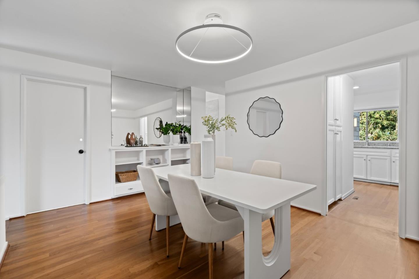2146 Sand Hill Road Menlo Park, CA 94025 - Photo 7 of 40 a view of a dining room with furniture and wooden floor
