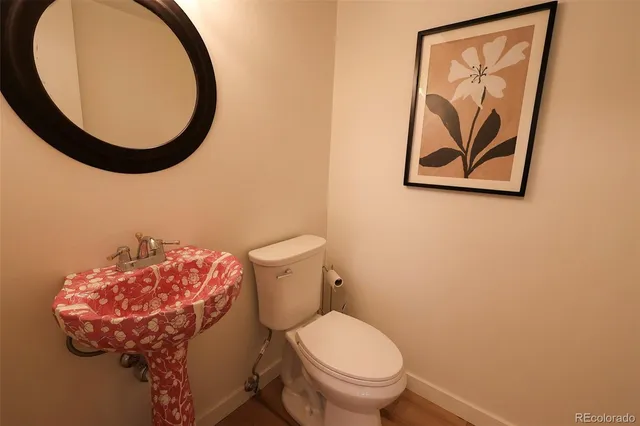 a bathroom with a toilet and a sink