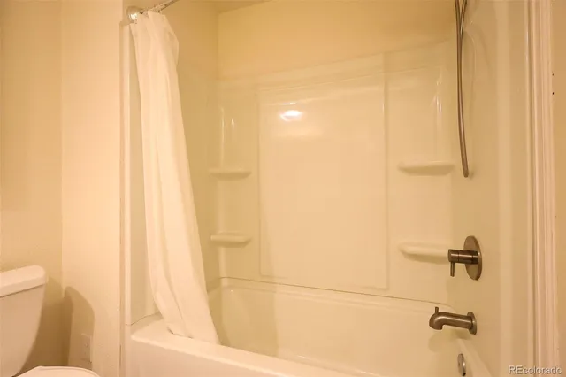 a bathroom with a bathtub and shower