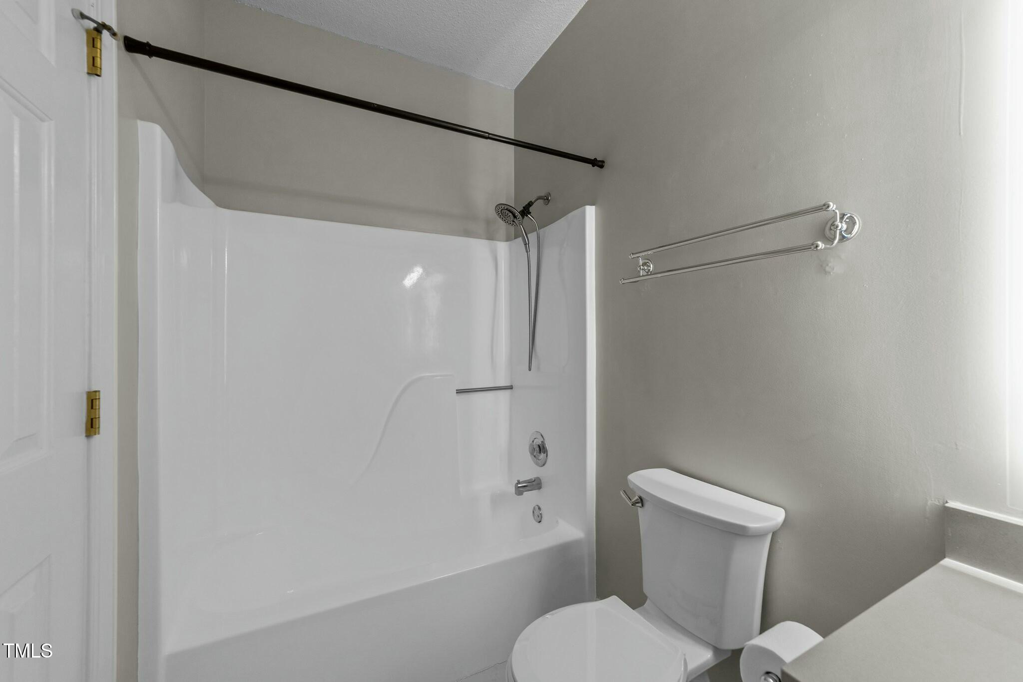 1234 Shadow Bark Court Raleigh, NC 27603 - Photo 12 of 36 a white toilet sitting next to a bathroom sink