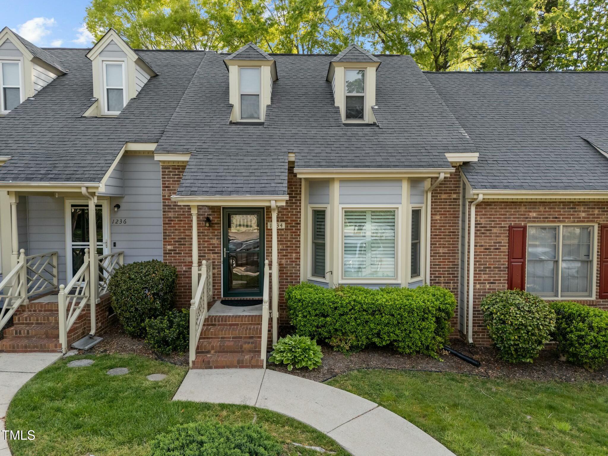 1234 Shadow Bark Court Raleigh, NC 27603 - Photo 2 of 36 front view of a house with a yard