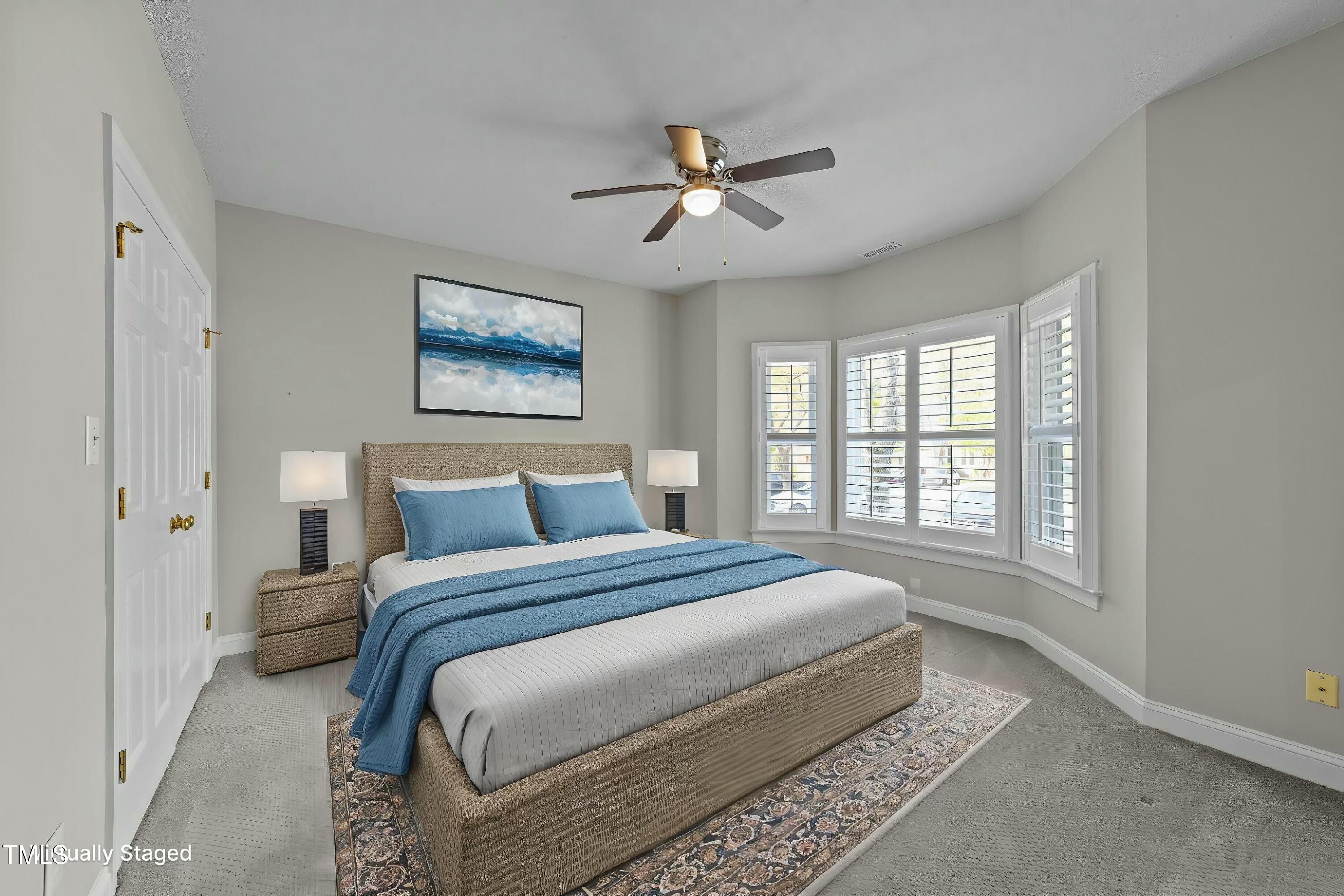 1234 Shadow Bark Court Raleigh, NC 27603 - Photo 8 of 36 a bedroom with a large bed and a window
