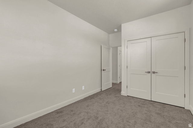 4016 South Burch Way Ogden, UT 84405 - Photo 20 of 30 Neutral tone wall finishes complemented by gray carpet flooring