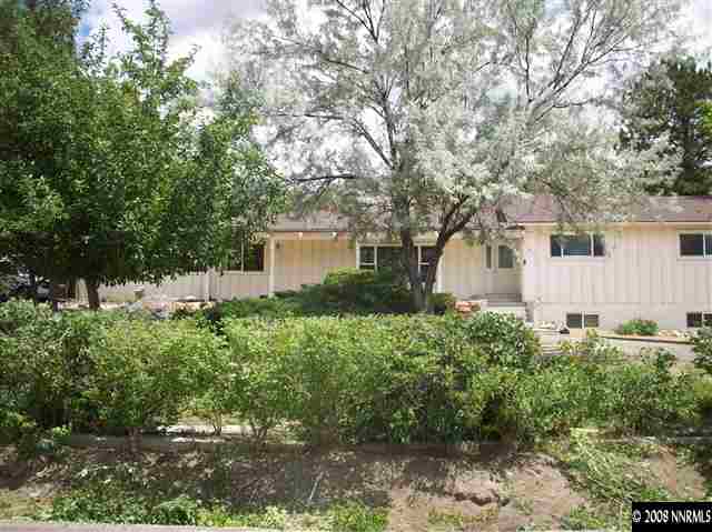 14440 Virginia Foothills Drive Reno, NV 89521 - Photo 1 of 9 a view of a house with a yard and plants