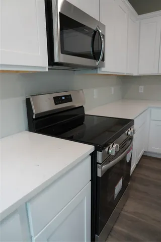 a close up of a stove top oven sitting inside of a kitchen