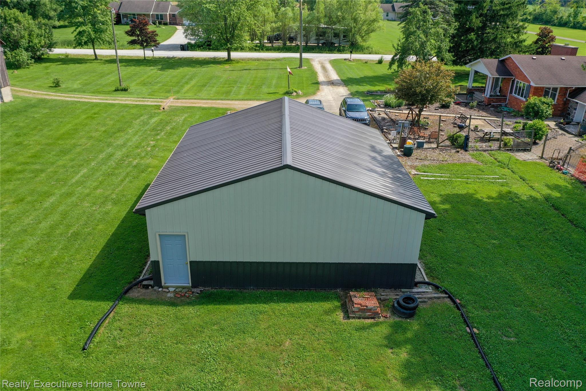 8728 Rynn Road Avoca, MI 48006 - Photo 33 of 53 Spacious outbuilding featuring a metal roof, two-tone siding, and a single entry door